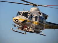 N120LA @ POC - LA Co crew waving to Pomona PD crew while on final for LA Co Air Ops helipad 2 - by Helicopterfriend