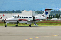 C-FLRD @ CYVR - Beech A100, c/n: B-243 - by Terry Fletcher