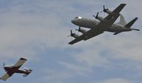 158918 @ KOSH - Navy P-3 going around after overtaking departing RV. - by Todd Royer