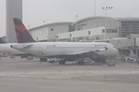 N337NW @ DTW - Delta A320 at McNamara Terminal - taken out of the hazed window of a US Airways A319 - by Florida Metal