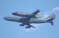 N905NA @ MCO - I really wish it would have been lower over MCO and didn't have the sun to its back.  I got off work at 7am, no time to drive to the Cape but heard it was flying over MCO around 7:40 so I ran to MCO to get it - by Florida Metal