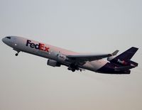 N628FE @ KLAX - Takeoff at dawn - by Jonathan Ma