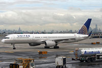 N14118 @ KEWR - A former CO 757 taxies in at Newark, with the New York City skyline as a dramatic backdrop. - by Daniel L. Berek