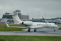VP-BNE @ EGCC - Jet Aviation Business Jets Gulfstream G550 taxiing at Manchester Airport. - by David Burrell