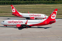 D-ABKY @ EDDK - Air Berlin D-ABKY with 'operated by TUIfly' sticker meets TUIfly D-AHXF wetleased to Air Berlin at CGN - by Thomas M. Spitzner