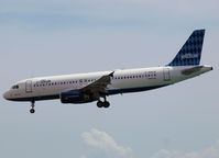 N516JB @ AUA - Landing on Reina Beatrix Airport Aruba - by Willem Göebel