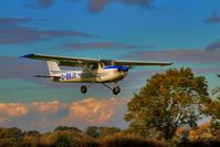 G-BBJX @ EGBR - Local Flying School on finals - by glider