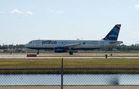 N595JB @ RSW - Taking off RWY 6 - by Mauricio Morro