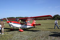 N28CM @ X36 - American Champion Citabria (N28CM) flies over Buchan Airport - by Jim Donten