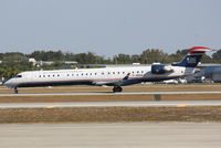 N933LR @ KSRQ - US Air Flight 2678 operated by Mesa (N933LR) departs Sarasota-Bradenton International Airport enroute to Charlotte-Douglas International Airport - by Jim Donten
