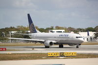 N24224 @ KSRQ - United Flight 1190 (N24224) arrives at Sarasota-Bradenton International Airport following a flight from Chicago-O'Hare International Airport - by Jim Donten