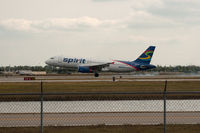 N606NK @ RSW - Spirit A320 touching down RWY 6 - by Mauricio Morro