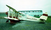 D-IGUN @ EDDL - De Havilland DH.89A Dragon Rapide [6437] (Air Classic) Dusseldorf~D 22/05/1982. Removed from roof of terminal and re-sited on road leading to the terminal along with other Air Classic aircraft. Image taken from a slide. - by Ray Barber