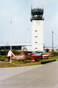 N8379K @ TEB - 1946 Stinson 108-1, N8379K and Control Tower at Teterboro Airport, Teterboro, NJ - by scotch-canadian