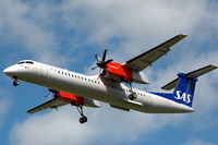 OY-KCE @ ESSA - SAS Dash-8-400 approaching Stockholm Arlanda airport, Sweden. - by Henk van Capelle