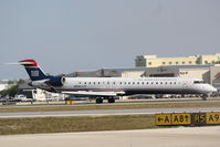 N914FJ @ KSRQ - US Air Flight 2675 operated by Mesa (N914FJ) arrives at Sarasota-Bradenton International Airport following a flight from Charlotte-Douglas International Airport - by Jim Donten