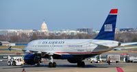 N712US @ KDCA - Push back with US Capitol in background - by Ronald Barker