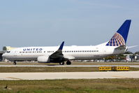 N76523 @ KSRQ - United Flight 1190 (N76523) arrives at Sarasota-Bradenton International Airport following a flight from Chicago-O'Hare International Airport - by Jim Donten