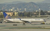 N597UA @ KLAX - Taxiing to gate at LAX - by Todd Royer