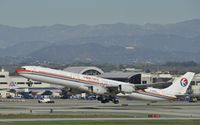 B-6050 @ KLAX - Departing LAX on 25R - by Todd Royer