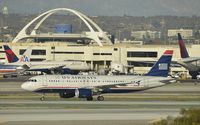 N128UW @ KLAX - Taxiing to gate - by Todd Royer