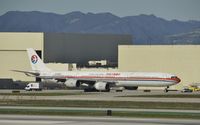 B-6050 @ KLAX - Taxiing for departure - by Todd Royer