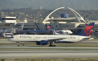 N697DL @ KLAX - Taxiing to gate - by Todd Royer