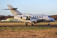 5N-BMR @ EGHH - Taxies to JETS after engine running - by John Coates