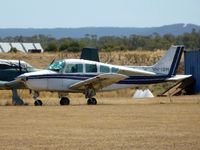 VH-ISM @ YMEL - This Beech Sierra is seen through the heat haze, parked at Melton airfield.