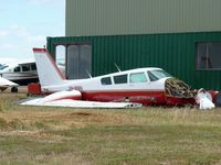 VH-MMN @ YBSS - Twin Comanche VH-MMN sitting beside the maintenance hangar at Bacchus Marsh, awaiting re-assembly perhaps,