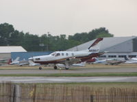 N898UT @ KOSH - landing on Rwy27 - by steveowen