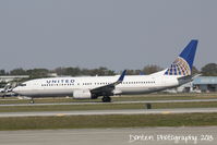 N12238 @ KSRQ - United Flight 1720 (N12238) departs Sarasota-Bradenton International Airport enroute to Chicago-O'Hare International Airport - by Donten Photography