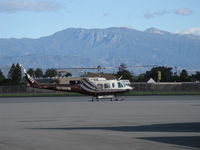 N510WW @ OXR - 2008 Bell Helicopter Textron 210, one Honeywell T5317B turbo-shaft engine of 1,500 Shaft Hp. In better light. The 210 is remanufactured version of Bell UH-1 Iroquois 'Huey.' 6,704' Hines Peak in Topa Topa Mtns. in right background. 6,244' dominant central - by Doug Robertson