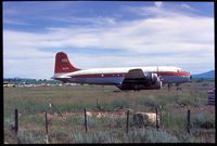 N67061 - In Idaho, possibly McCall. Sometime in 1950 to 1960. Looks like a fire retardant pod on it. Probably taken by Harold Gene Crosby - by Harold Gene Crosby