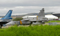 9243 @ EGQL - 211tl Gripen on the flightline at Leuchars airshow 2011 - by Mike stanners