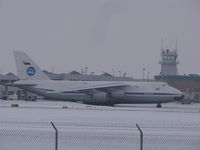RA-82014 @ KGRB - a grey snowy day at Green Bay with a minus 19C temperature . - by steveowen