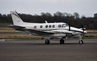 N200RE @ EGFH - Visiting King Air basking in the rain. - by Roger Winser