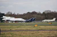 M-ROWL @ EGHH - Being towed past Cobham ramp. - by John Coates