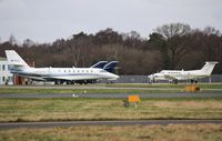 M-ISLE @ EGHH - Taxies past Cobham to depart. - by John Coates