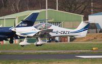 G-CBZX @ EGHH - Resident Banbi arriving in the sun - by John Coates
