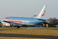 G-THOG @ EGHH - Thomsonfly.com, tyres smoking as it touches down. - by Howard J Curtis