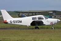 G-OXOM @ EGHH - Hints of the previous, more interesting colour scheme! - by Howard J Curtis
