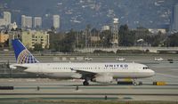 N409UA @ KLAX - Taxiing to gate at LAX - by Todd Royer