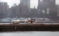N99041 @ JRB - Air Kaman Bell 212 at Downtown Manhattan Heliport in basic Bristow Helicopter colour scheme. - by paul.thallon