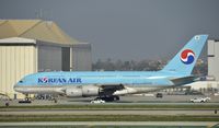 HL7612 @ KLAX - Taxiing for departure at LAX - by Todd Royer