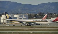 9V-SGD @ KLAX - Taxiing to gate at LAX - by Todd Royer