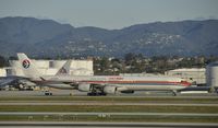 B-6052 @ KLAX - Taxiing to gate at LAX - by Todd Royer