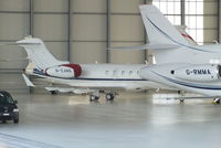 M-EANS @ LSGG - YH Aviation Challenger 300 in the Jet Aviation hangar - by Chris Hall