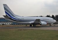 VP-CAJ @ EGHH - European Skybus LLC's 737 being pushed back - by John Coates