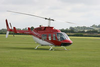 G-SUEY @ EGDY - At the Air Day. Giving helicopter rides. - by Howard J Curtis